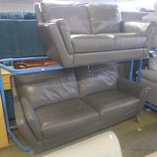 1735 - A grey leather effect two seater and three seater sofa -worn