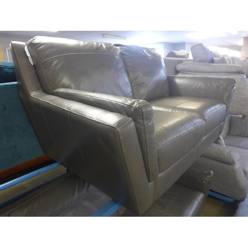 1735 - A grey leather effect two seater and three seater sofa -worn