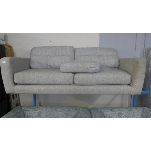 1740 - A grey textured three seater sofa, marked, missing feet and damaged underside