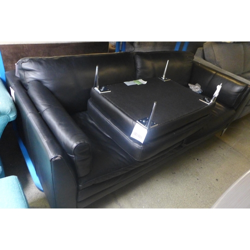 1744 - A black leather effect two seater, three seater sofa and footstool (two seater missing legs, both wo... 