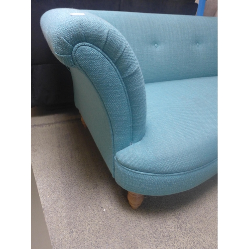 1745 - A teal two seater sofa and footstool