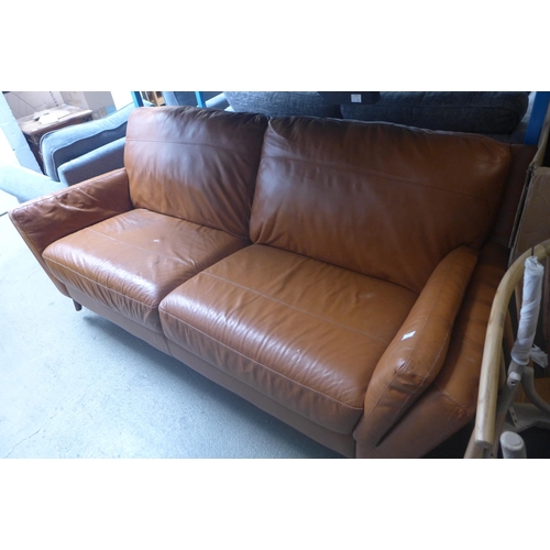 1779 - A light grey upholstered two seater sofa and a tan leather effect three seater sofa (both with damag... 