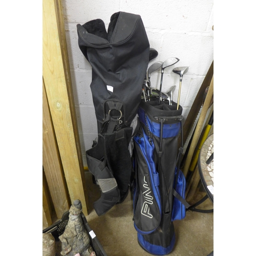 2396 - 2 x golf bags with a quantity of clubs