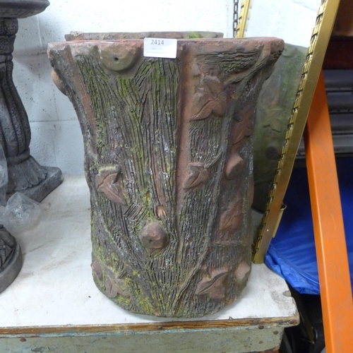 2414 - A pair of 18 inch high clay planters