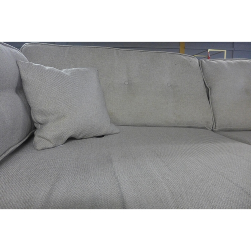 1755 - A grey textured weave three seater sofa (missing some feet) and a brown leather effect three seater ... 