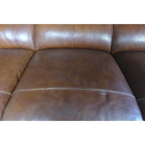 1755 - A grey textured weave three seater sofa (missing some feet) and a brown leather effect three seater ... 