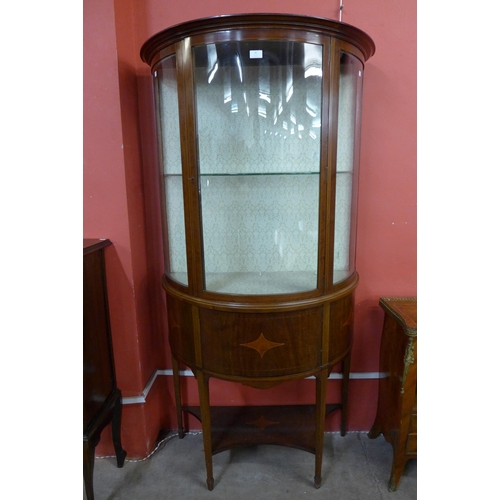 29 - An Edward VII inlaid mahogany bow front display cabinet