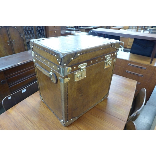 149 - A brown leather and brass mounted trunk