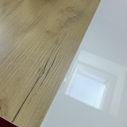 1450 - A Corran white gloss and oak extending dining table with a set of four Arana red velvet chairs