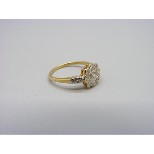 1093 - An 18ct gold and diamond daisy ring, 2.7g, M