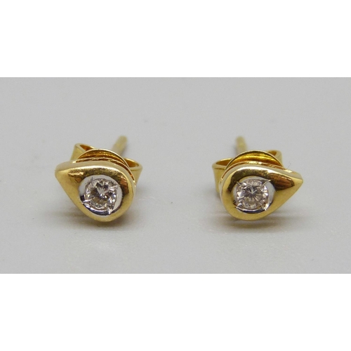 1094 - A pair of 18ct gold and diamond stud earrings, 1.2g