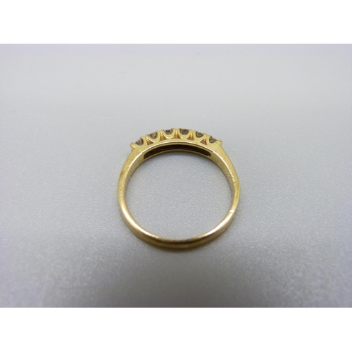 1097 - An 18ct gold and six stone diamond ring, 2.6g, M