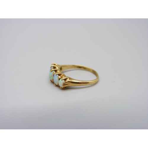 1098 - An yellow metal and five stone opal ring, 3.5g, M, hallmark worn