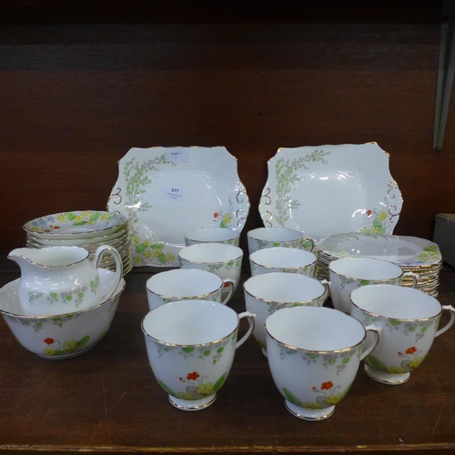 677 - A Tuscan China Plant Art Deco tea set, eleven setting, lacking one cup