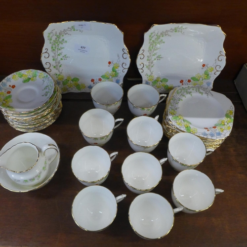 677 - A Tuscan China Plant Art Deco tea set, eleven setting, lacking one cup