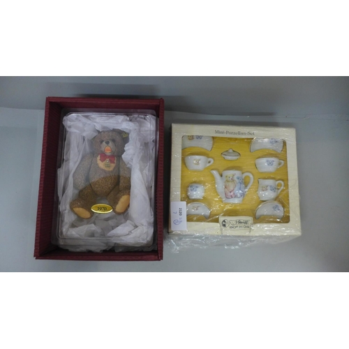 680 - A Steiff pottery teddy bear and a Steiff dolls house miniature tea set, boxed