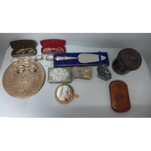 711 - A Bakelite tobacco jar, a silver handled cake slice, an eastern inlaid dish, old spectacles, etc.