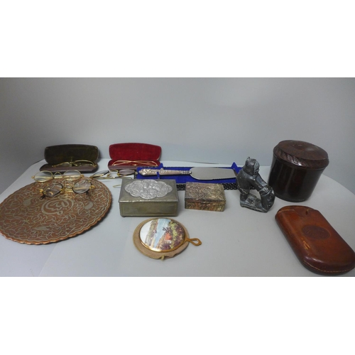 711 - A Bakelite tobacco jar, a silver handled cake slice, an eastern inlaid dish, old spectacles, etc.