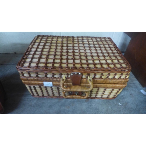 715 - A wicker hamper, a leather satchel, case and wooden box