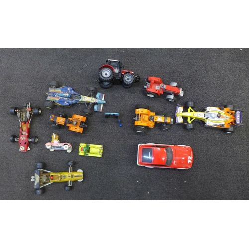 724 - A collection of die-cast model vehicles, Britains tractors, a Michael Schumacher Benneton racing car... 