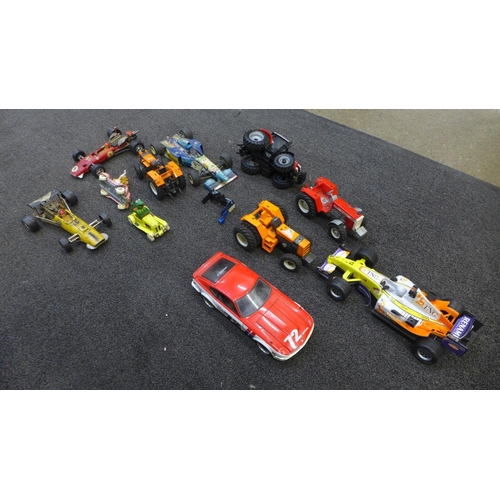 724 - A collection of die-cast model vehicles, Britains tractors, a Michael Schumacher Benneton racing car... 