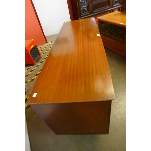 105 - A teak and tola wood sideboard