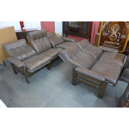 106 - A Danish Skippers Mobler beech and brown leather reclining two piece lounge suite, model no. 7882, d... 