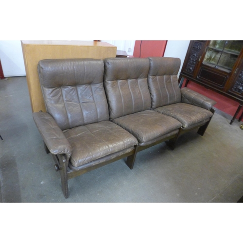 106 - A Danish Skippers Mobler beech and brown leather reclining two piece lounge suite, model no. 7882, d... 