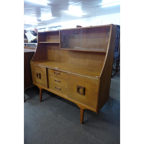 109 - A teak highboard