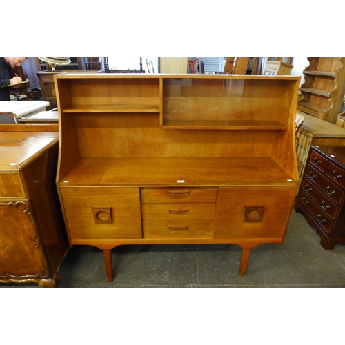 109 - A teak highboard