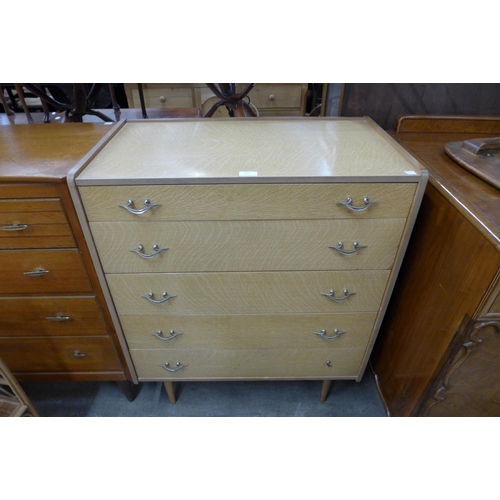 119 - A William Lawrence simulated oak chest of drawers