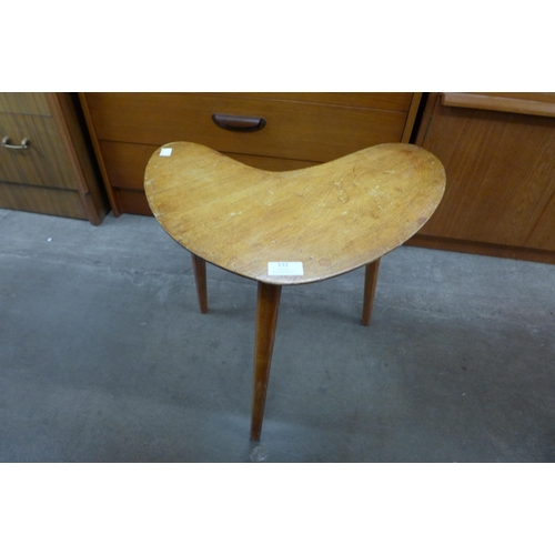 133 - A teak boomerang shaped coffee table