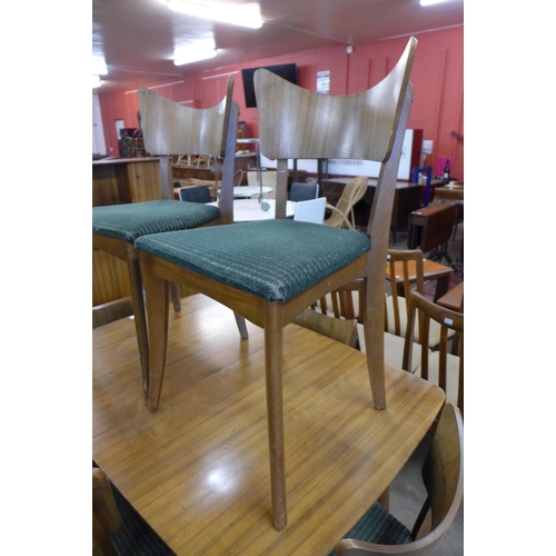 136 - A Vanson afromosia dining table and six chairs