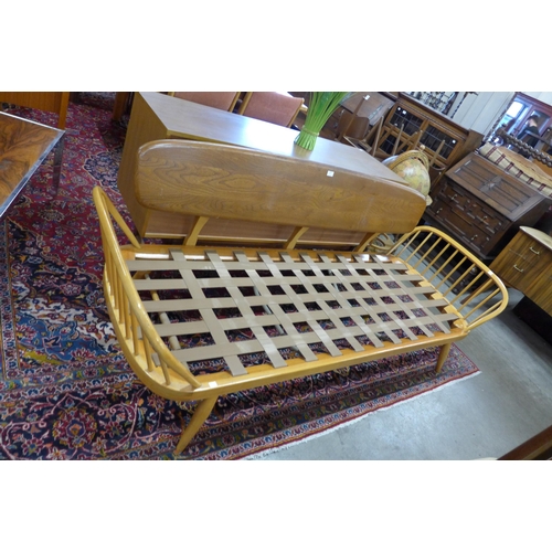 138 - An Ercol Blonde elm and beech 355 model studio couch