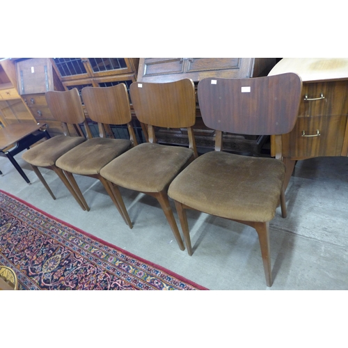 141 - A set of four teak dining chairs