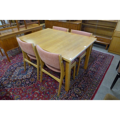 144 - A Swedish Troeds light oak extending dining table and four chairs