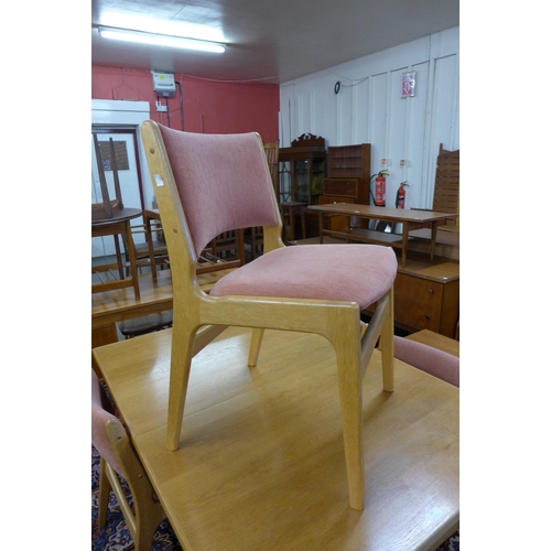 144 - A Swedish Troeds light oak extending dining table and four chairs