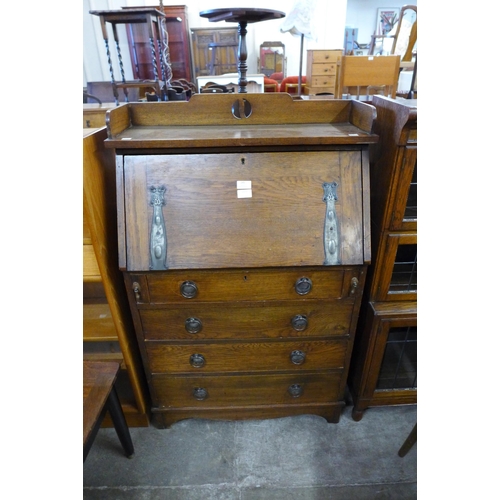 145 - An Arts and Crafts oak bureau