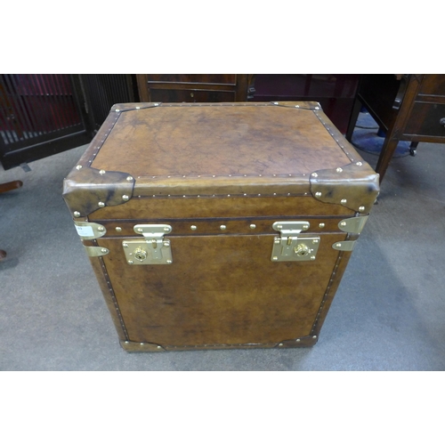 149 - A brown leather and brass mounted trunk