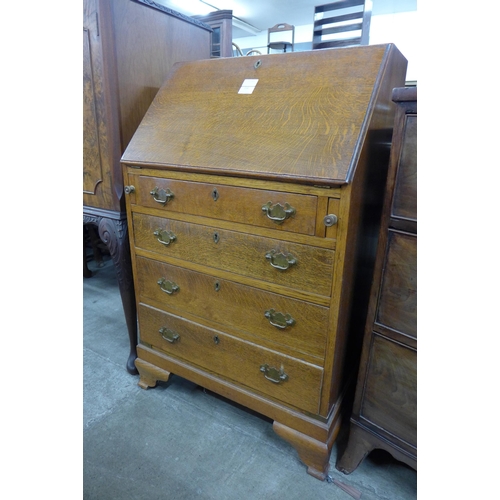 154 - A George III style oak bureau