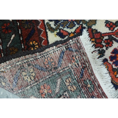 168 - A Persian red ground Shiraz rug, 151 x 106cms