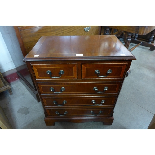 176 - A small inlaid mahogany chest of drawers