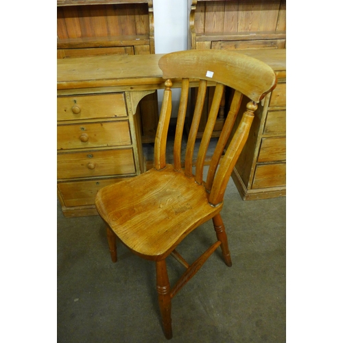 180 - A set of six Victorian elm and beech kitchen chairs