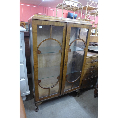 189 - A walnut display cabinet