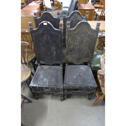 209 - A set of four 19th Century Spanish carved oak and embossed leather chairs