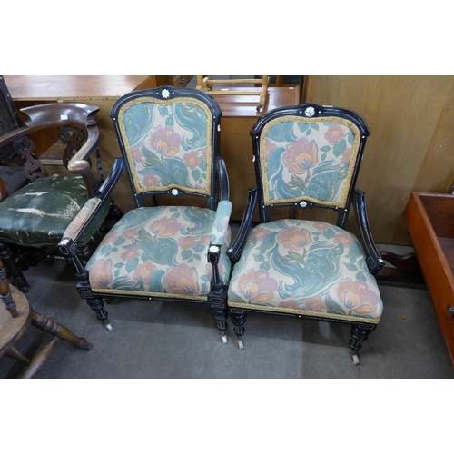 215 - A pair of Victorian Aesthetic Movement ebonised and fabric upholstered chairs