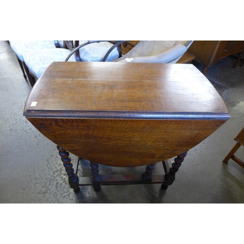 229 - An oak barleytwist gateleg table