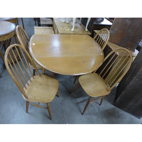 286 - An oak  drop-leaf table and four chairs