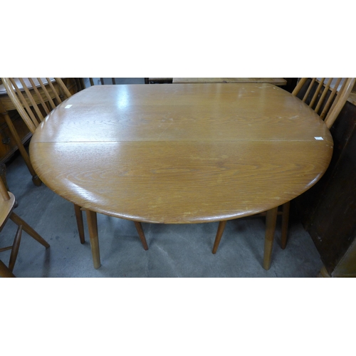 286 - An oak  drop-leaf table and four chairs