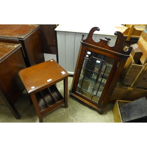 335 - A mahogany wall hanging corner cabinet and a magazine stand